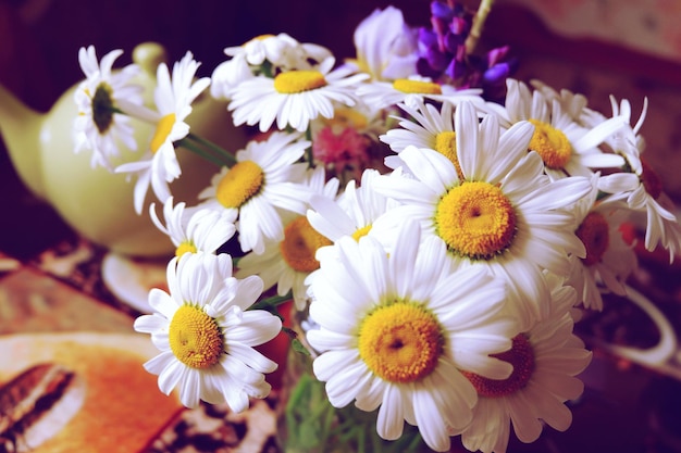 still life with a bouquet of chamomile in the kitchen