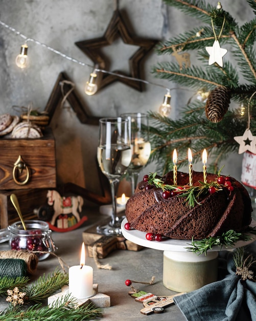 Still life with Christmas Bundt Cake with candles Traditional festive dessert on christmas themed