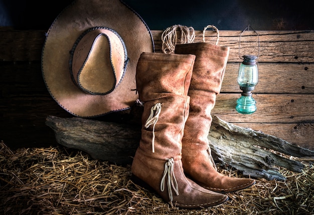 Still life with cowboy hat and traditional leather boots