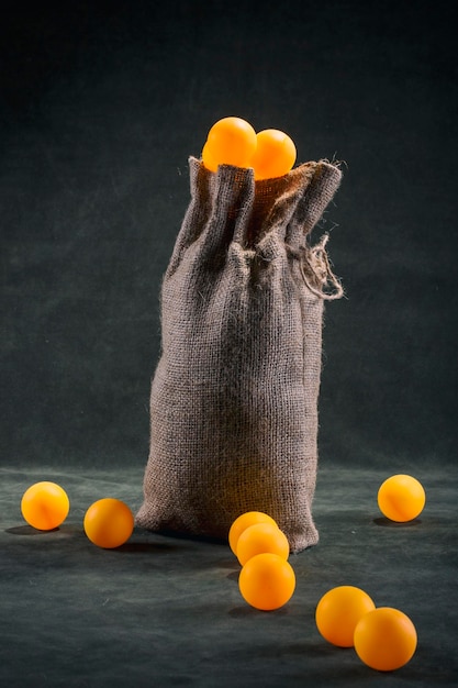 Still life with a full bag of orange balls