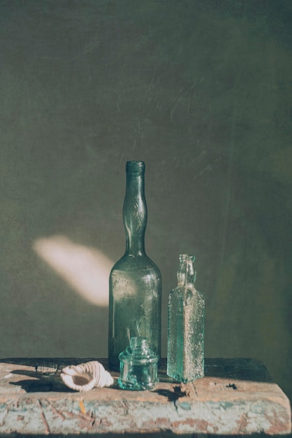 Still life with glass bottles of various shapes art photography