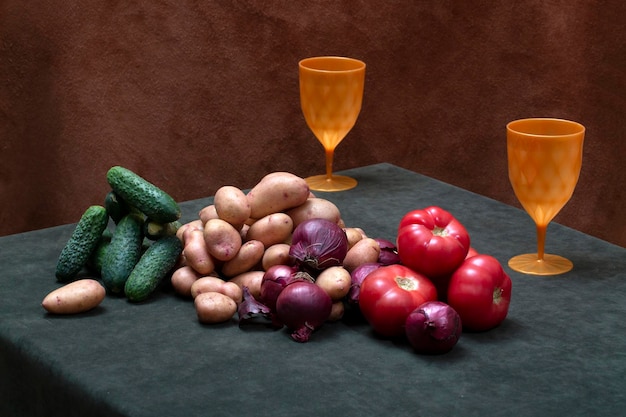 Still life with glasses and fresh vegetables