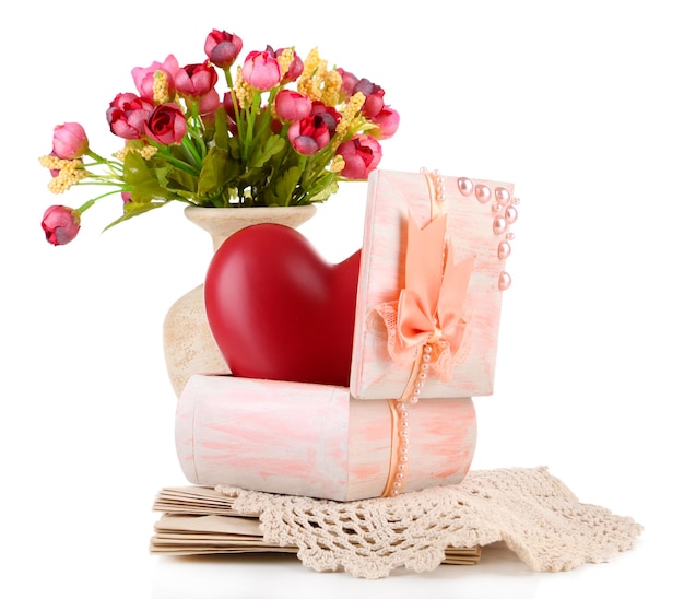 Still life with heart in wooden casket, isolated on white