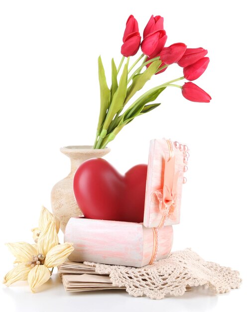 Still life with heart in wooden casket, isolated on white