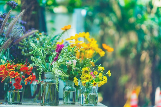 Still life with huge bunch of autumn flowers and roses and fruits