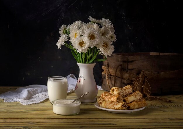 Still life with kefir sour cream and delicious pancakes with meat