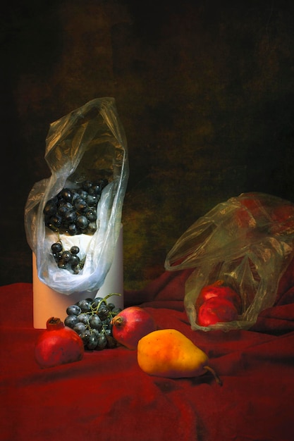 Still life with pear grapes and ripe pomegranates