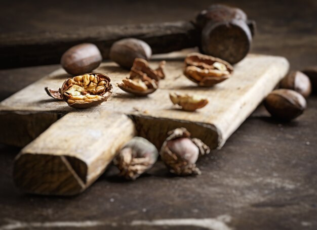 Still life with pecans on a wooden table