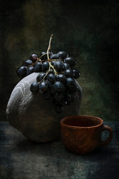 Still life with ripe grapes on a stone