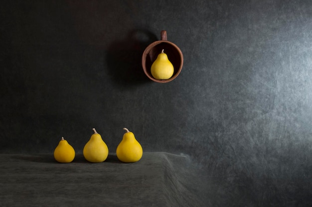 Still life with small decorative pumpkins on the table and in the bowl