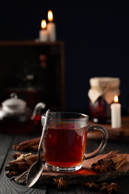 Still life with spices and hot tea in a glass