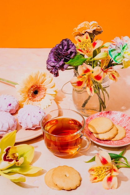 Still life with tea and flowers. Postcard for women's day