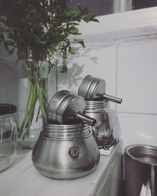 Still life with two steel coffee pots in kitchen