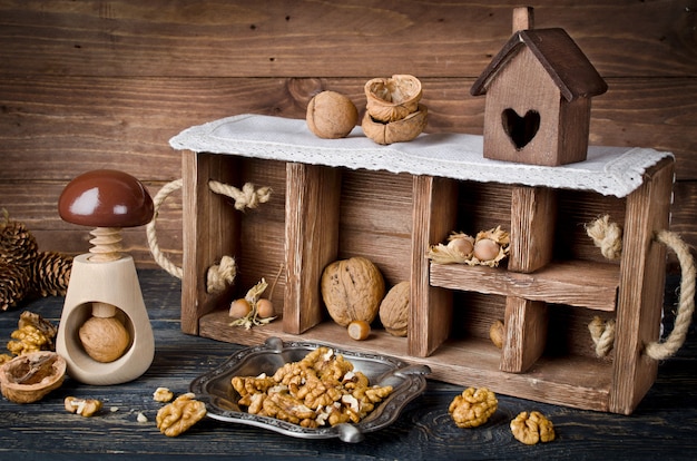 Still life with a wooden box and nuts. Horizontal image