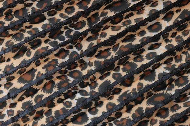 Stipes of fabric with leopard pattern close up