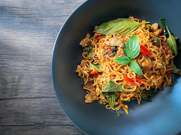 Stir fire spicy noodle with clam on the table