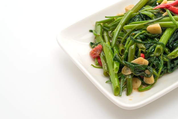 Stir-Fried Chinese Morning Glory or Water Spinach isolated on white