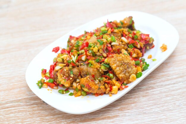 Stir Fried crispy pork with salt fresh red chili minced garlic and spring onion It has spicy flavor