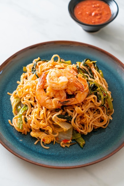 Stir-fried instant noodles sukiyaki with shrimps - Asian food style