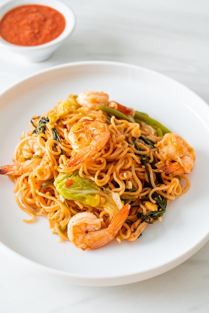 Stir-fried instant noodles sukiyaki with shrimps - Asian food style