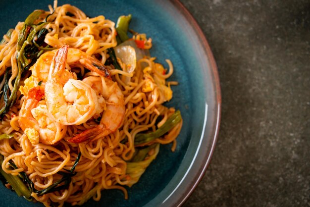 Stir-fried instant noodles sukiyaki with shrimps - Asian food style