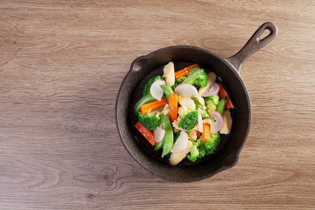 Stir fried mixed vegetables in a pan on the table