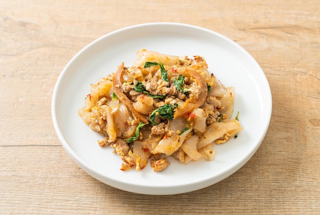 Stir-fried noodle with minced chicken and basil - Asian food style