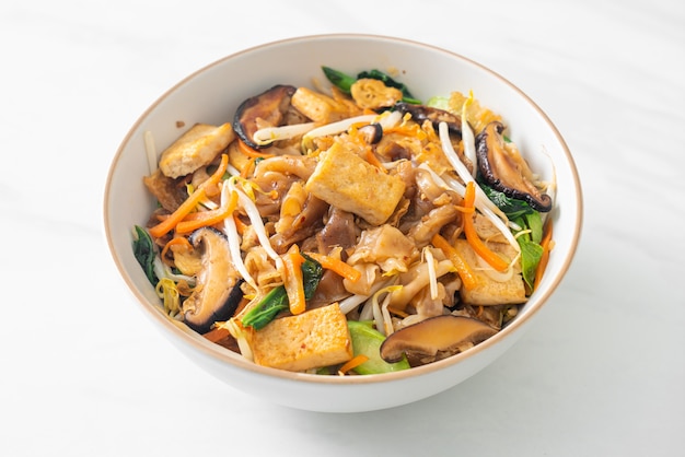 stir-fried noodles with tofu and vegetables - vegan and vegetarian food style