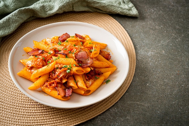 stir-fried penne pasta with kimchi and bacon - fusion food