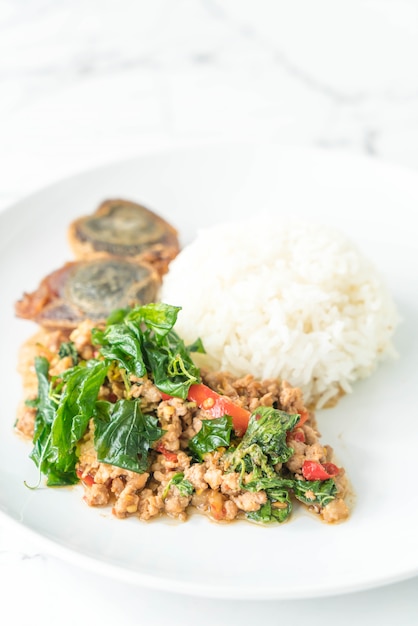 stir-fried pork and basil with egg and rice