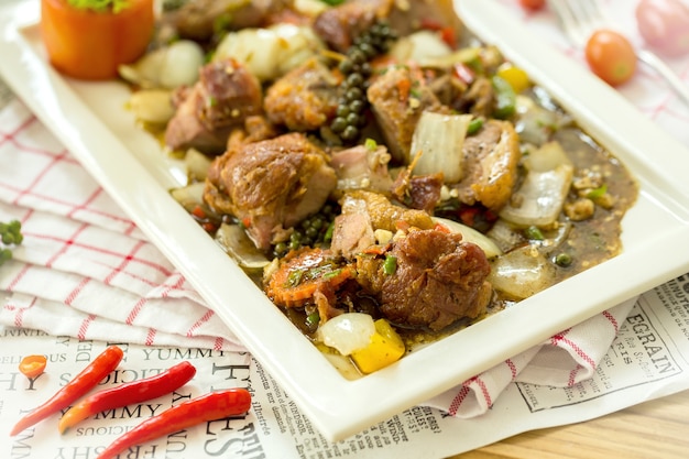 Stir Fried Pork with Black Pepper isolated on napery