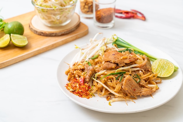 stir-fried rice noodles with pork in Asian style