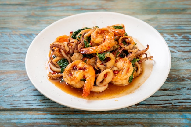 stir-fried seafood (shrimps and squid) with Thai basil - Asian food style