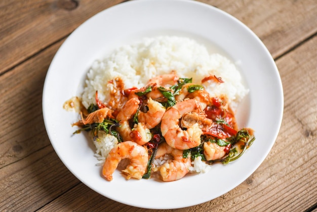 Stir fried shrimp, Cooked rice and fried basil with shrimps prawns,Thai food rice topped shrimp with holy basil leaves