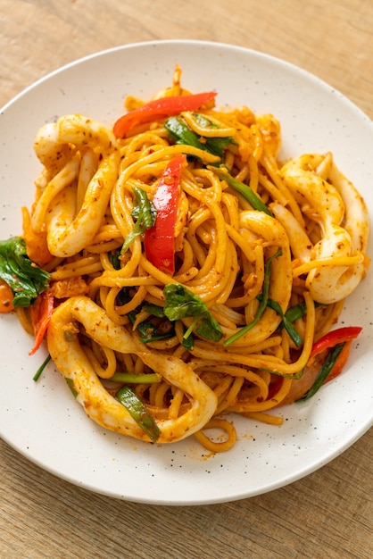 stir-fried spaghetti with salted egg and squid - fusion food style