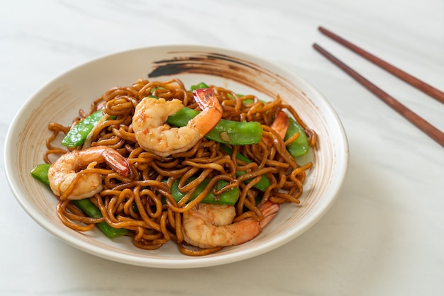 stir-fried yakisoba noodles with green peas and shrimps - Asian food style