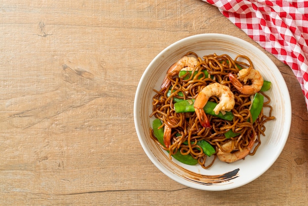 stir-fried yakisoba noodles with green peas and shrimps - Asian food style