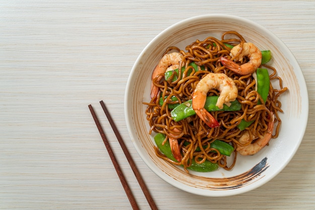 stir-fried yakisoba noodles with green peas and shrimps - Asian food style