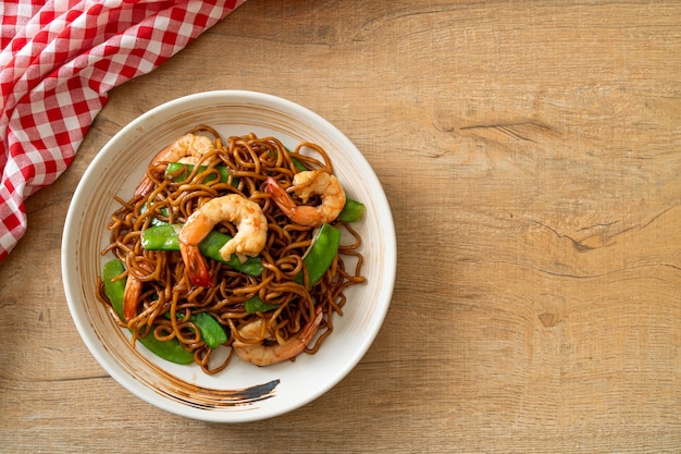 stir-fried yakisoba noodles with green peas and shrimps - Asian food style