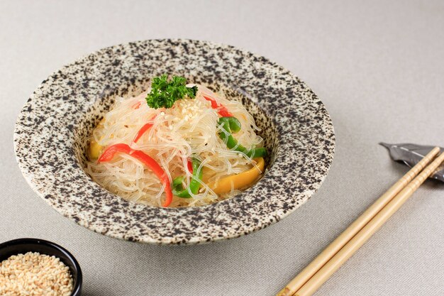 Stir Fry Glass Rice Noodles with Vegetables  Red Yellow and Green Bell Peppersn