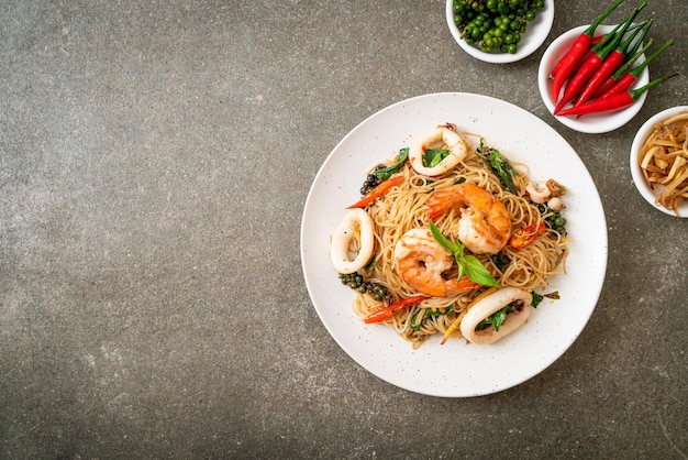 Stirfried Chinese noodle with basil chilli shrimps and squid