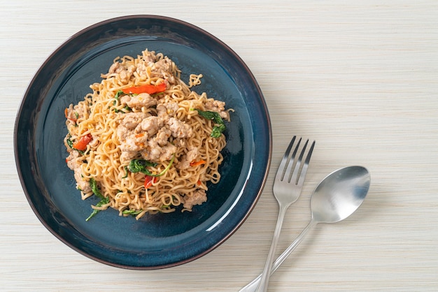 Stirfried instant noodles with basil and minced pork