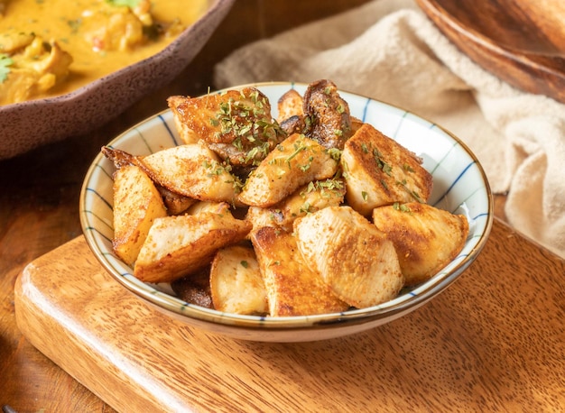 Stirfried Mushrooms with Mixed Spices in a dish on wooden background top view