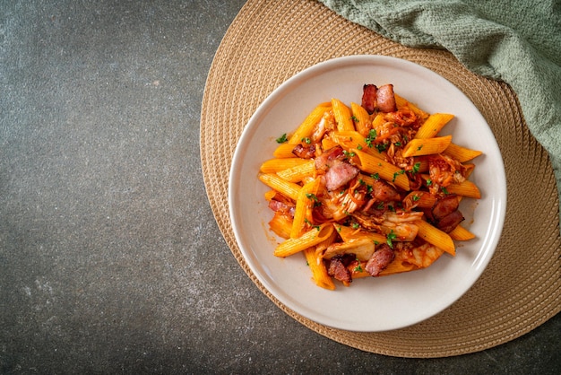 Stirfried penne pasta with kimchi and bacon