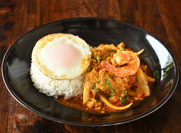 Stirfried prawns with curry powder with fried egg rice Thai food thai cuisine food on dish look good tase