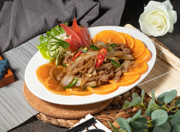 Stirfried Sha cha lamb served in dish isolated on table top view of chines food