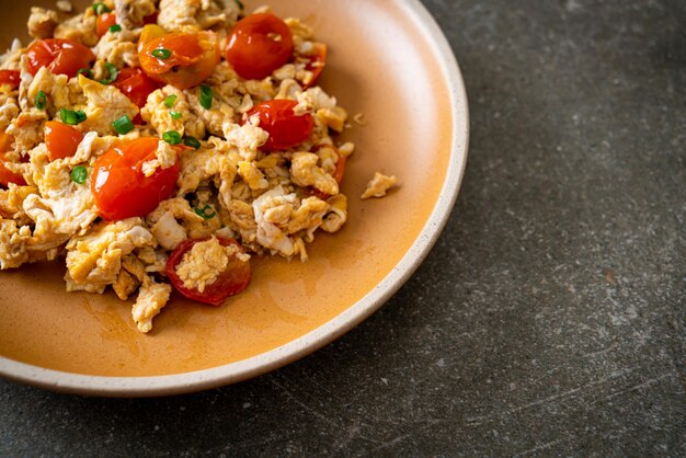 Stirfried tomatoes with egg on plate