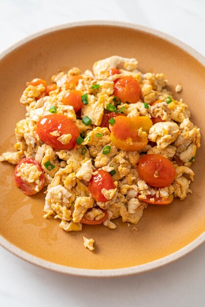 Stirfried tomatoes with egg on plate