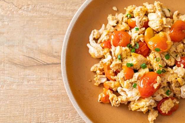 Stirfried tomatoes with egg on plate