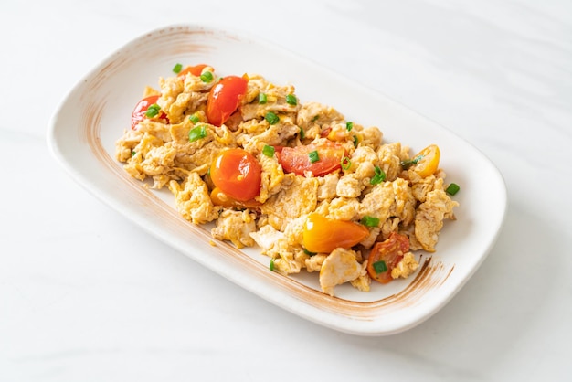 Stirfried tomatoes with egg on plate